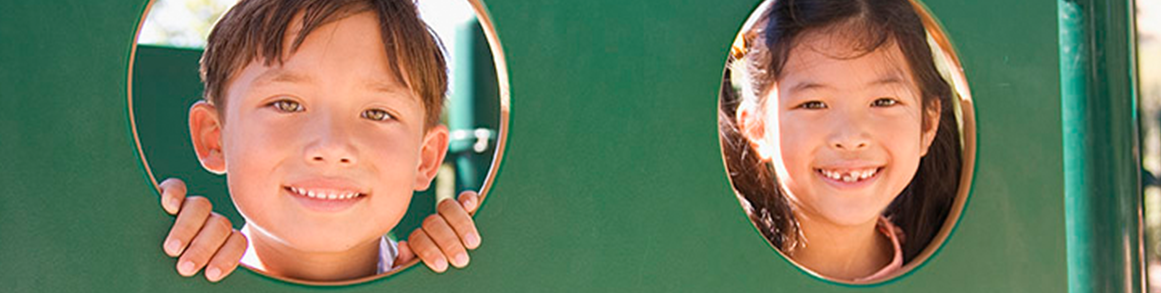 2 students in green playground 